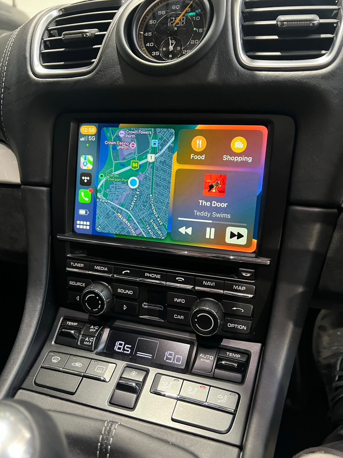 Factory Porsche dashboard retaining its original screen and controls